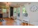 Bright and airy living space with a chalkboard wall, leading to an outdoor deck area at 1239 Mac Ln, Stanley, NC 28164