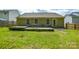 Backyard featuring a wooden deck, green lawn, and a wood privacy fence at 1312 Shenandoah Cir, Rock Hill, SC 29730