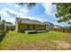 Spacious backyard with a small deck, grassy area, surrounded by wooden fences at 1312 Shenandoah Cir, Rock Hill, SC 29730