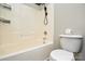 Bright bathroom featuring a shower-tub combination with white tile and a matching toilet at 1312 Shenandoah Cir, Rock Hill, SC 29730