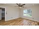 Bedroom showcasing stylish flooring, ceiling fan, natural light, and neutral color scheme at 1312 Shenandoah Cir, Rock Hill, SC 29730
