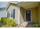 Bright entrance with a black front door, sidelight window and tile flooring at 1312 Shenandoah Cir, Rock Hill, SC 29730