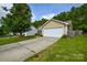 Charming home with a two-car garage and well-maintained lawn on a sunny day at 1312 Shenandoah Cir, Rock Hill, SC 29730