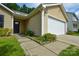 Cozy home with a two-car garage, front door, and landscaped garden at 1312 Shenandoah Cir, Rock Hill, SC 29730