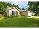 Inviting home with a lush green lawn, manicured bushes and a well-kept garden at 1312 Shenandoah Cir, Rock Hill, SC 29730