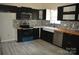 A well-equipped kitchen has stainless steel appliances, stylish tile backsplash, and modern fixtures at 1312 Shenandoah Cir, Rock Hill, SC 29730