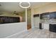 Open-concept kitchen featuring modern lighting, gray wood-look floors, and sleek cabinetry at 1312 Shenandoah Cir, Rock Hill, SC 29730