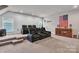 Finished basement with theater seating, wall decor, speaker system, and carpeting on split level platform at 1320 Torrens Dr, Wesley Chapel, NC 28110