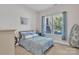 Cozy bedroom features a comfortable bed with coordinated decor and a bright window at 1320 Torrens Dr, Wesley Chapel, NC 28110