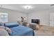 Spacious bedroom features two beds, comfortable seating and fun decor at 1320 Torrens Dr, Wesley Chapel, NC 28110