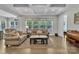 Cozy living room with comfortable seating, a large window, and hardwood floors at 1320 Torrens Dr, Wesley Chapel, NC 28110