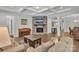 Open living room with fireplace, hardwood floors, and neutral decor at 1320 Torrens Dr, Wesley Chapel, NC 28110