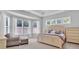 Bright and airy main bedroom with a comfortable seating area and bay windows at 1320 Torrens Dr, Wesley Chapel, NC 28110