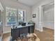 Bright and spacious home office with large window, desk, and hardwood floors at 1320 Torrens Dr, Wesley Chapel, NC 28110
