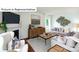 Inviting living room with cozy seating, stylish decor, fireplace, and a view of the outdoors at 1341 Secrest Commons Dr, Monroe, NC 28112