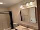 Standard bathroom with a shower and bathtub combination and vanity mirror at 1519 Midland Dr, Hudson, NC 28658