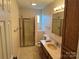 Bathroom with vanity, shower, tile floors and walls at 1519 Midland Dr, Hudson, NC 28658