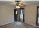 Cozy bedroom with neutral walls, carpeted floors, and a ceiling fan with lighting at 1519 Midland Dr, Hudson, NC 28658