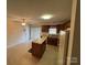 Kitchen featuring wooden cabinets, laminate countertop, a center island, and a ceiling fan at 1519 Midland Dr, Hudson, NC 28658