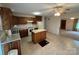 Kitchen featuring wooden cabinets, laminate countertop, a center island, and a ceiling fan at 1519 Midland Dr, Hudson, NC 28658