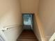Carpeted staircase leading to the basement at 1519 Midland Dr, Hudson, NC 28658