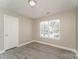 Bright bedroom with neutral walls, providing a serene and adaptable space, complemented by modern, wood-look floors at 1522 Tuckers Glenn Dr, Rock Hill, SC 29732
