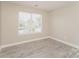 Bright bedroom with neutral walls, providing a serene and adaptable space, complemented by modern, wood-look floors at 1522 Tuckers Glenn Dr, Rock Hill, SC 29732