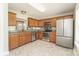 Functional kitchen featuring granite countertops, stainless steel appliances, and warm wood cabinets under natural light at 1522 Tuckers Glenn Dr, Rock Hill, SC 29732