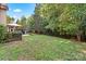 Expansive backyard with mature trees, offering plenty of room for recreation and relaxation at 1800 Robbins Meadows Dr, Waxhaw, NC 28173