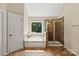 Bright bathroom with garden tub and walk-in shower enhanced with tile surround at 1800 Robbins Meadows Dr, Waxhaw, NC 28173