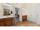 Well-lit bathroom featuring double vanity, tile floors, and a separate shower at 1800 Robbins Meadows Dr, Waxhaw, NC 28173
