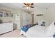 Neutral bedroom featuring a ceiling fan, a large window, and a comfortable bed at 1800 Robbins Meadows Dr, Waxhaw, NC 28173