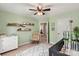 Charming Bedroom with soothing green walls, crib, and rocker, creating a peaceful space at 1800 Robbins Meadows Dr, Waxhaw, NC 28173