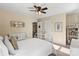 Cozy bedroom features a comfortable bed, decorative mirror and complementary artwork on the wall at 1800 Robbins Meadows Dr, Waxhaw, NC 28173