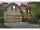 Charming home featuring a manicured lawn, a two-car garage, and a stone-accented porch at 1800 Robbins Meadows Dr, Waxhaw, NC 28173