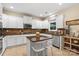 Eat-in kitchen showcases granite counters, an island with seating, and stainless steel appliances at 1800 Robbins Meadows Dr, Waxhaw, NC 28173