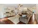 Welcoming living room with dark wood floors, area rug, and a comfortable sofa at 1800 Robbins Meadows Dr, Waxhaw, NC 28173