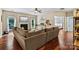 Cozy living room featuring a fireplace, neutral tones, and lots of natural light streaming through the windows at 1800 Robbins Meadows Dr, Waxhaw, NC 28173