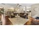 Spacious living room features hardwood floors, a large sectional, and an inviting open layout at 1800 Robbins Meadows Dr, Waxhaw, NC 28173
