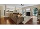 Elegant living room with fireplace, a large sectional sofa, and seamless transition to the kitchen at 1800 Robbins Meadows Dr, Waxhaw, NC 28173