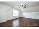 Finished attic space with hardwood floors, natural light, and a ceiling fan at 198 Devon Forest Dr, Mooresville, NC 28115
