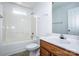 Bright bathroom featuring a shower-tub combo, a window, and a modern sink at 198 Devon Forest Dr, Mooresville, NC 28115