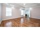 Large bedroom featuring hardwood floors, natural light, and trey ceiling at 198 Devon Forest Dr, Mooresville, NC 28115