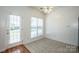 Bright breakfast area with windows, and door to backyard at 198 Devon Forest Dr, Mooresville, NC 28115