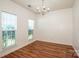 Dining room featuring hardwood floors, bright lighting, and views of the front yard at 198 Devon Forest Dr, Mooresville, NC 28115