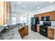 Functional kitchen featuring black appliances, and a view of the breakfast area at 198 Devon Forest Dr, Mooresville, NC 28115