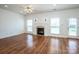 Spacious living room with hardwood floors, fireplace, ceiling fan, and natural light at 198 Devon Forest Dr, Mooresville, NC 28115