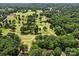 Scenic aerial view of a golf course, showing lush green fairways and tree-lined landscapes at 2104 Stoneyridge Dr, Charlotte, NC 28214