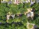 Aerial shot of houses with tree coverage showing the yards, and houses at 2104 Stoneyridge Dr, Charlotte, NC 28214