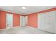 Bedroom featuring coral walls, double door closet and connecting bath at 2104 Stoneyridge Dr, Charlotte, NC 28214